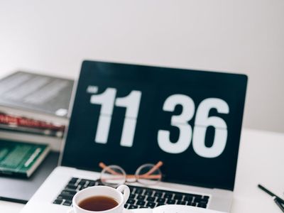 Minimalist desk setup with coffee and notebook